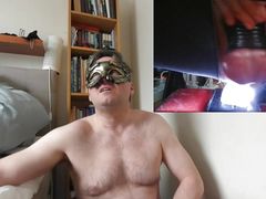 Riding illuminated dildo with strapped cock