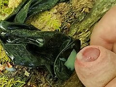 Outdoor cumshot in a used condom in the forest