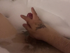 The man jacks off taking a tub with foam