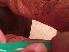 putting toothbrush in cock