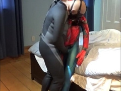 wetsuited crazy boy plays with his spiderman fool