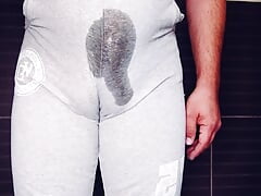 Chubby man pissing in pants and masturbating