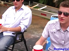 Outdoor college initiation with teen tugging