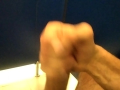 Pig Fellow Spunks in the Public Restroom while Snooping on a Stranger Peeing Next Door