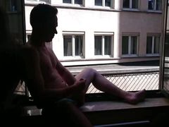 Short - Wanking in front of open hotelroom window with cumshot