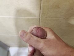 Milking off in the douche with powerful cum shot