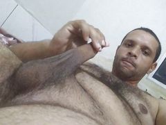 Young bear shows his face, body and masturbates while lying on his bed 1
