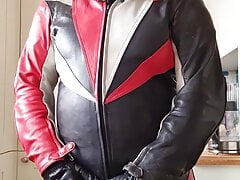 Wanking in biker leathers and helmet