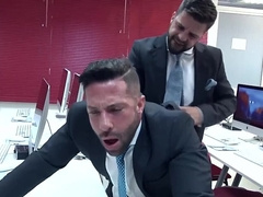 Office hunk taking care of his prey in front of the computer