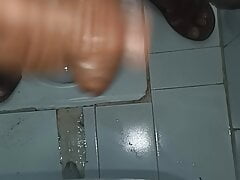 Indian middle age man massage his pennis with oil and gel